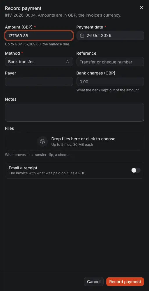 The drawer Record payment of an invoice: the amount, up to the balance due, the day, the method, the reference and payer, what the bank kept, files, and whether to email a receipt.