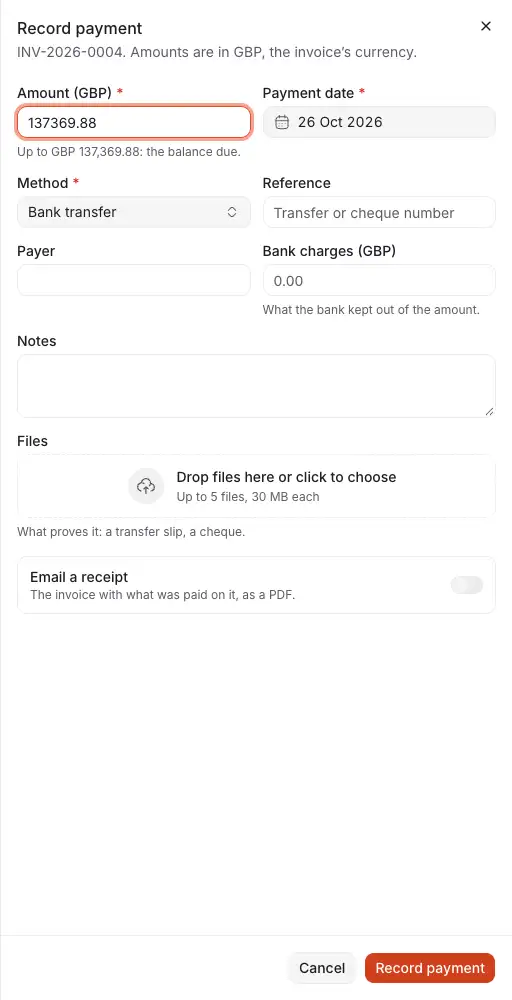 The drawer Record payment of an invoice: the amount, up to the balance due, the day, the method, the reference and payer, what the bank kept, files, and whether to email a receipt.